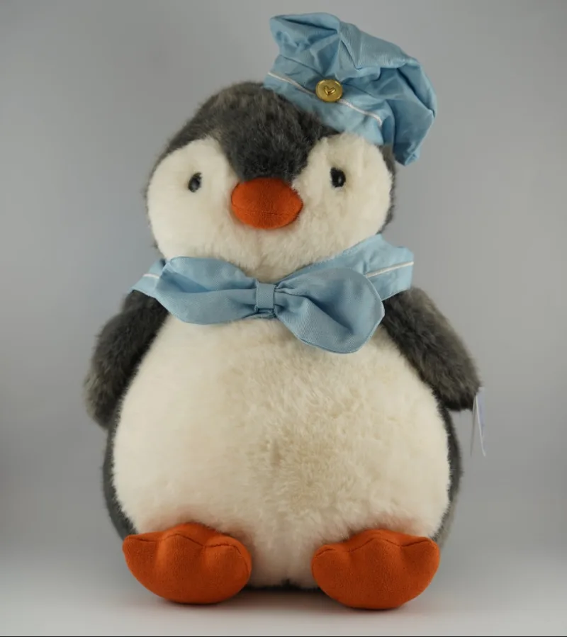 PELUCHE PINGÜINO CON AUDIFONOS Y PEZ